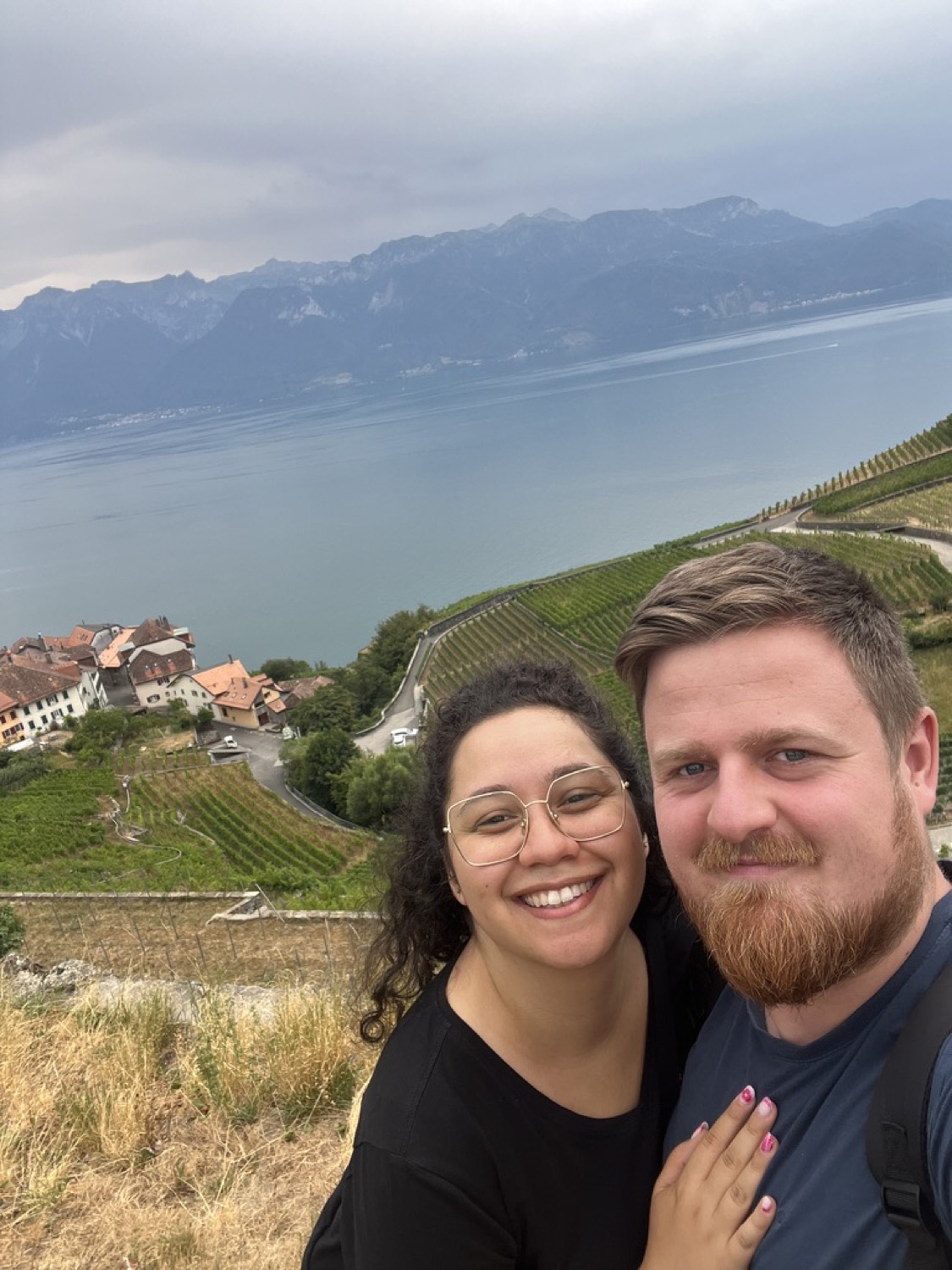 Annatina and Simon smiling together in the mountains